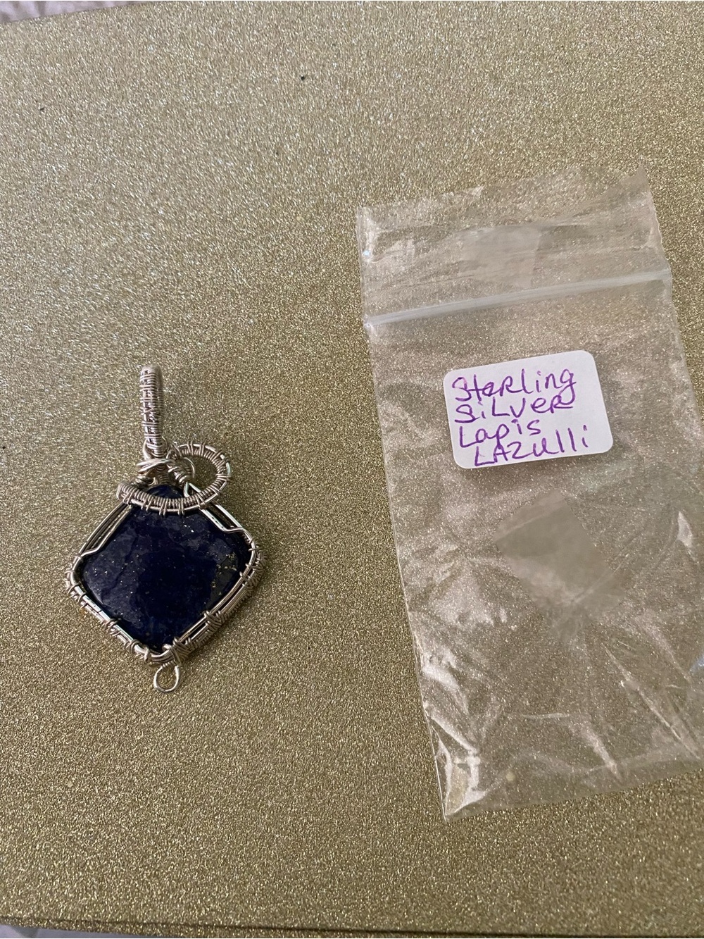 Lapis Lazuli Cabochon wrapped in Sterling silver.